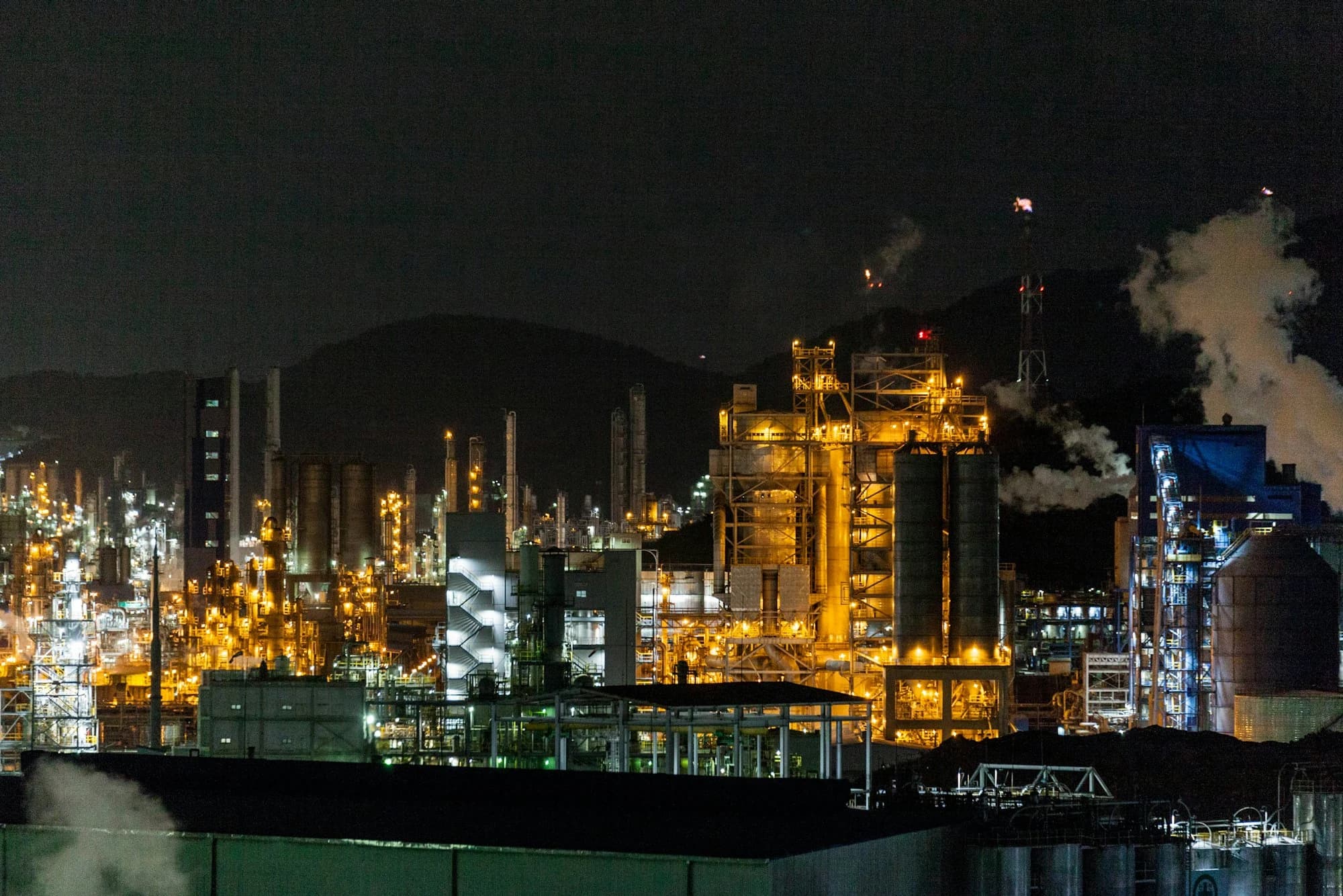 Petrochemical refinery illuminated at night