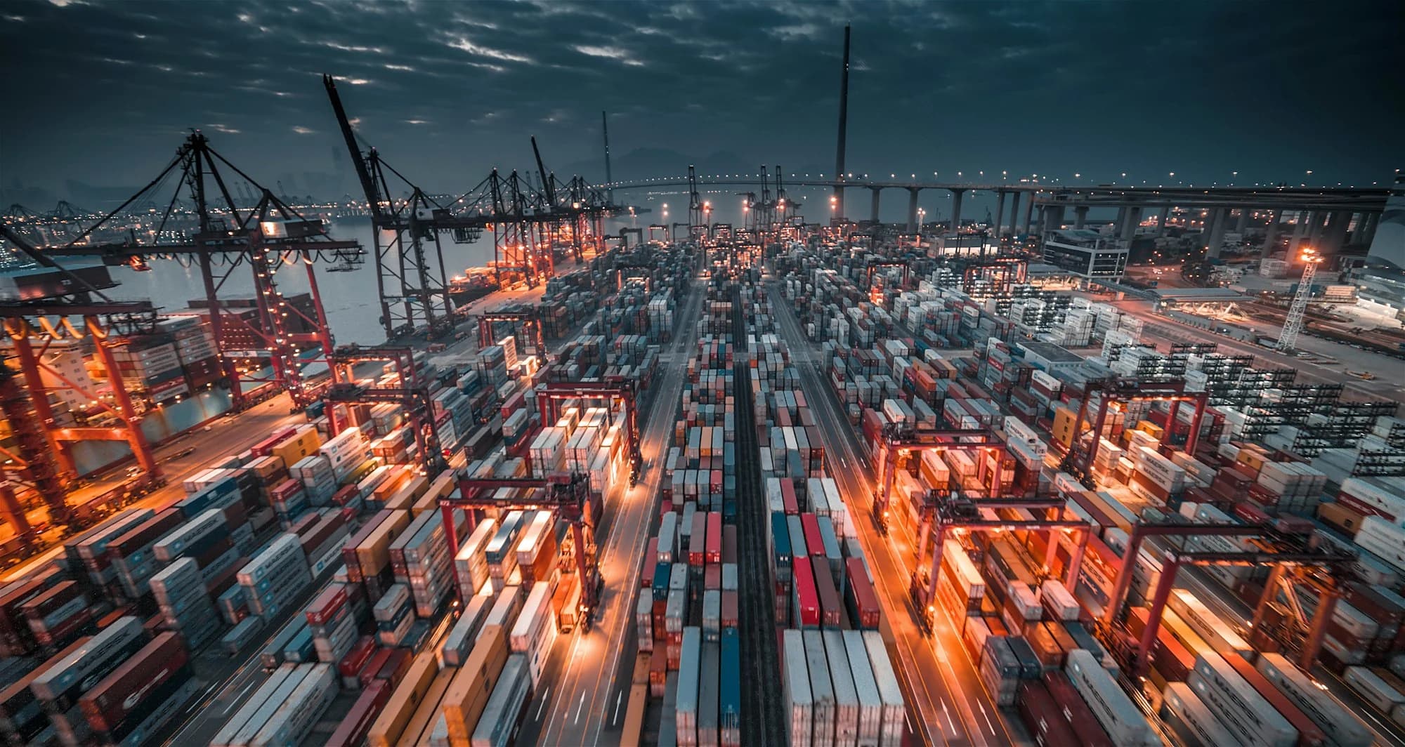 Container terminal with cranes at dusk